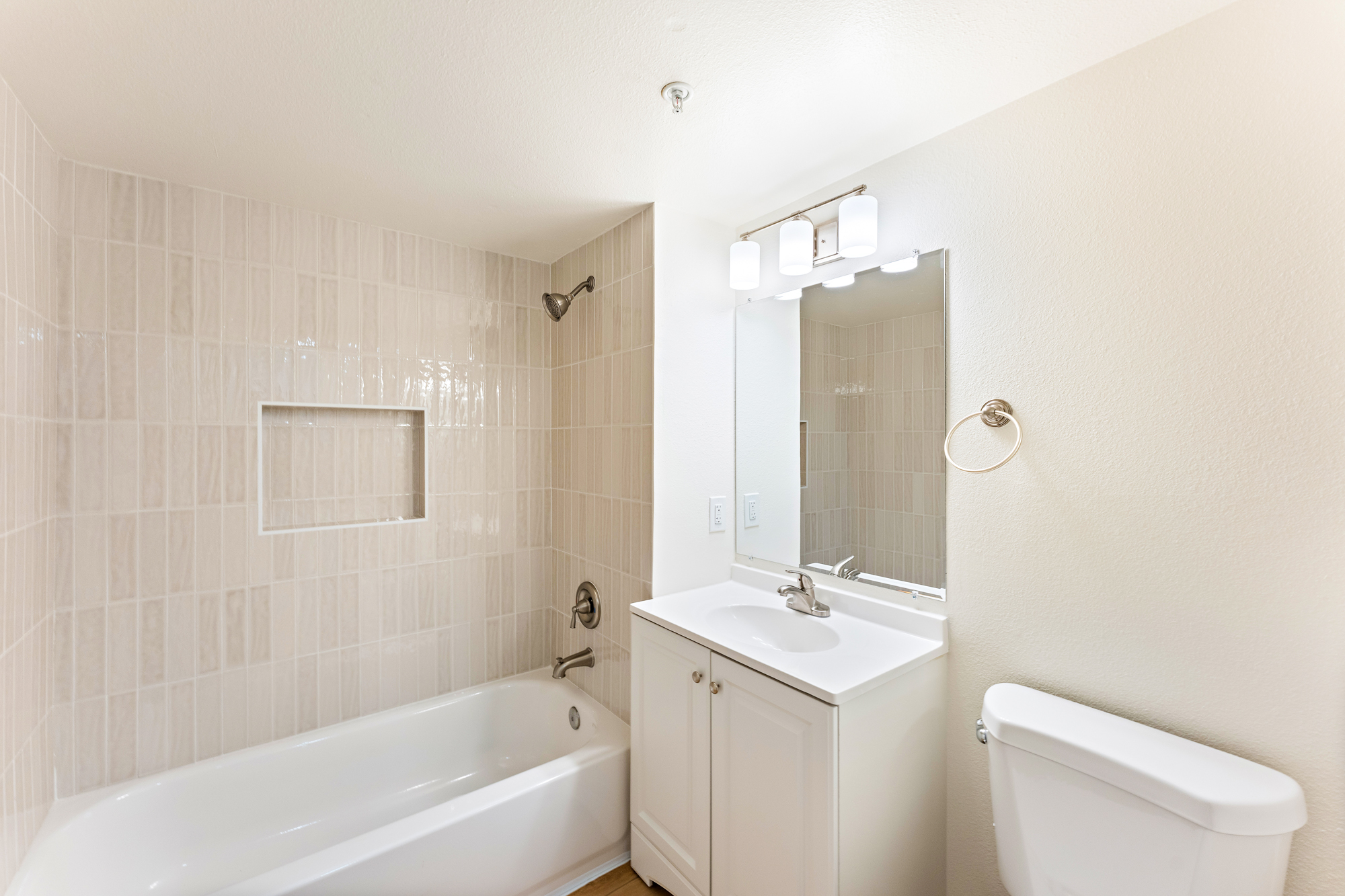 Bathroom renovation with new tile and fixtures